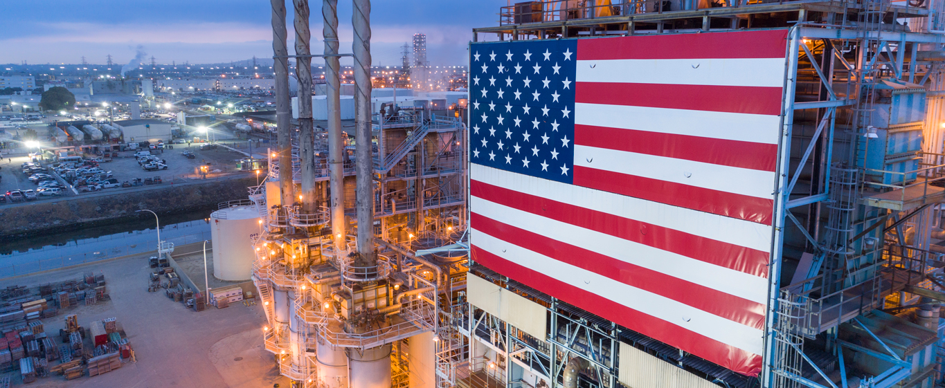 LAR Refinery illuminated at night and displaying the american flag. LAR Refinery illuminated at night and displaying the american flag.