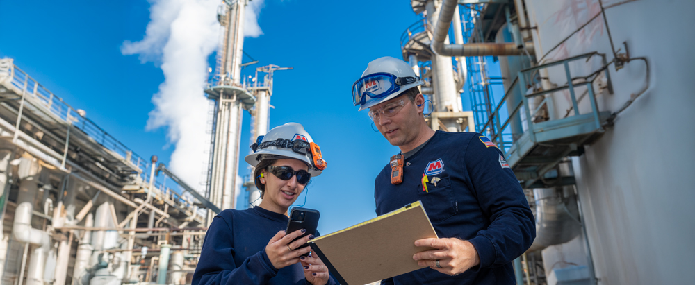 LAR employees reviewing safety procedures within the refinery. 